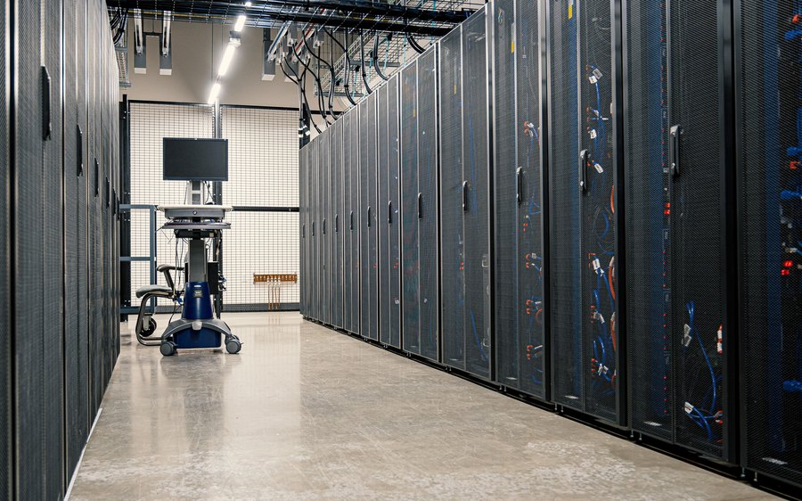 An aisle of server racks in a data centre
