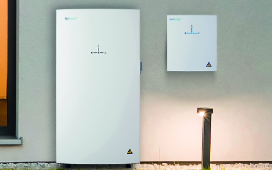 A home battery and inverter mounted on a house wall